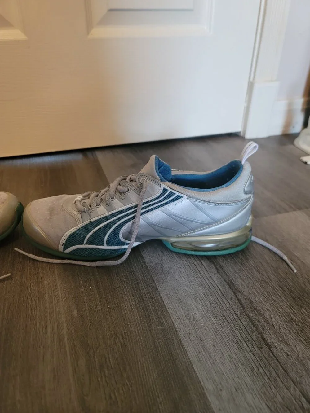 Womens grey and blue puma tennis shoes - has damage - size 10